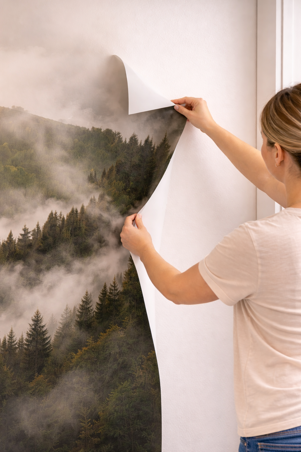 woman removing peel and stick wallpaper